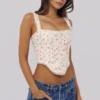 Adina witte katoenen corset-top met rozenprint en geschulpte rand
