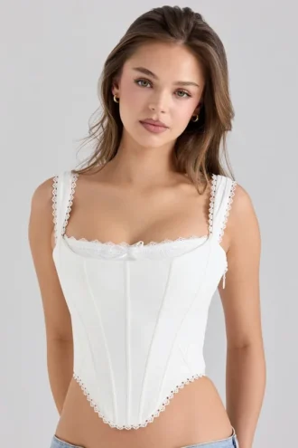 Adina witte stretch katoenen korset-top met geschulpte rand