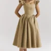 Alessandra gouden jacquard midi-jurk met afneembare strikken