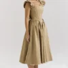 Alessandra gouden jacquard midi-jurk met afneembare strikken