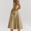 Alessandra gouden jacquard midi-jurk met afneembare strikken