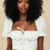 Arianna ivoorkleurige cropped top met bloemenprint en pofmouwen