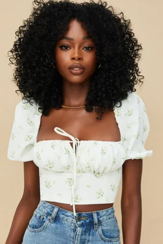 Arianna ivoorkleurige cropped top met bloemenprint en pofmouwen