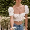 Arianna ivoorkleurige cropped top met bloemenprint en pofmouwen