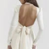 Aryana ivoorkleurige mini-jurk met strikken