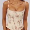 Cadie ivoorkleurige katoen-korset-top met vintage rozenprint