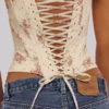 Cadie ivoorkleurige katoen-korset-top met vintage rozenprint