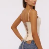 Cadie Vintage ivoorkleurige satijnen korsetten-top