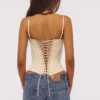 Cadie Vintage ivoorkleurige satijnen korsetten-top