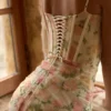 Calista perzikkleurige maxi-jurk met bloemenprint en mesh