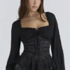 Cara Zwarte Georgette Peplumtop met Lange Mouwen