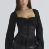 Cara Zwarte Georgette Peplumtop met Lange Mouwen