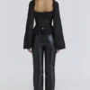 Cara Zwarte Georgette Peplumtop met Lange Mouwen