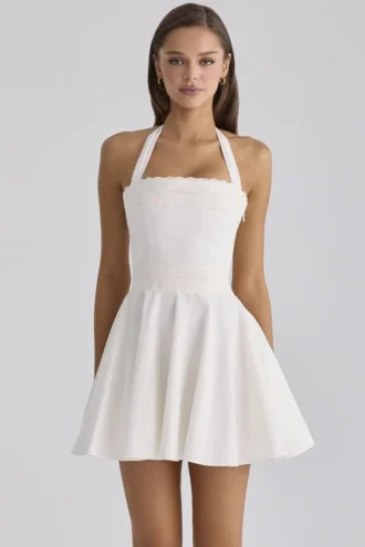 Cosette witte mini-halterjurk met broderie anglaise en katoen