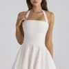Cosette witte mini-halterjurk met broderie anglaise en katoen