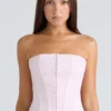 De strapless roze stretchkorset-top