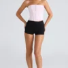 De strapless roze stretchkorset-top