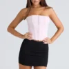 De strapless roze stretchkorset-top