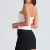 De strapless roze stretchkorset-top