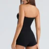 De strapless zwarte stretch korset top