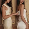 Isis ivoorkleurige satijnen corset maxi-jurk