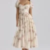 Penelope ivoorkleurige midi-jurk van chiffon met vintage rozenprint