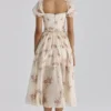 Penelope ivoorkleurige midi-jurk van chiffon met vintage rozenprint