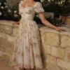 Penelope ivoorkleurige midi-jurk van chiffon met vintage rozenprint