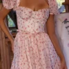 Penelope witte midi-jurk met rozenprint en georgette lint