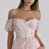 Penelope witte midi-jurk met rozenprint en georgette lint