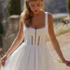 Perle witte midi-jurk met kanten rand
