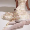 Rosalee ivoorkleurige katoenen bustier-Zomerjurk met weideprint