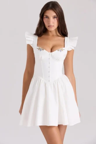 Sisi witte katoenen mini-jurk met borduursels