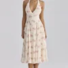 Solada ivoorkleurige midi-halterjurk van georgette met vintage rozenprint
