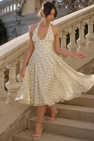 Solada ivoorkleurige vintage halterjurk met bloemenprint van georgette