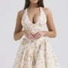 Valentia ivoorkleurige mini-halterjurk met weideprint